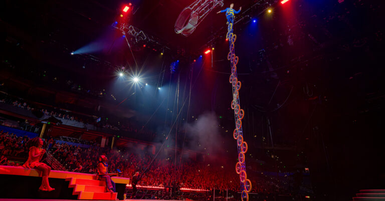 Wesley on a tall unicycle