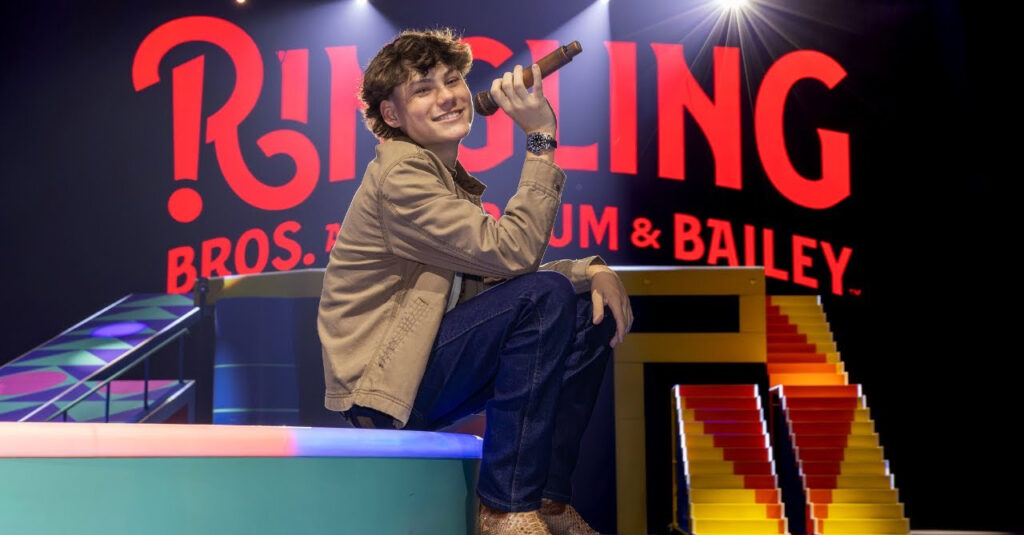 Maddox Batson in front of the Ringling logo
