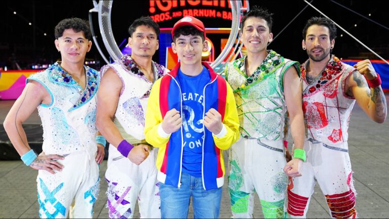 Jason standing with Ringling performers