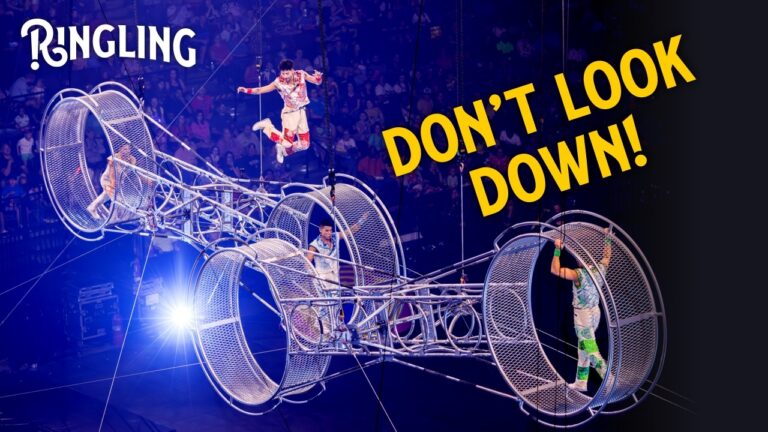 Ringling - don't look down - image of performers on giant wheels on the Ringling stage