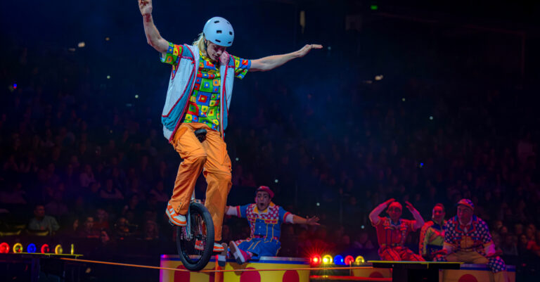 A unicyclist performs on the Ringling stage