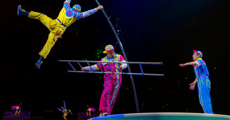 Three Ringling performers on stage